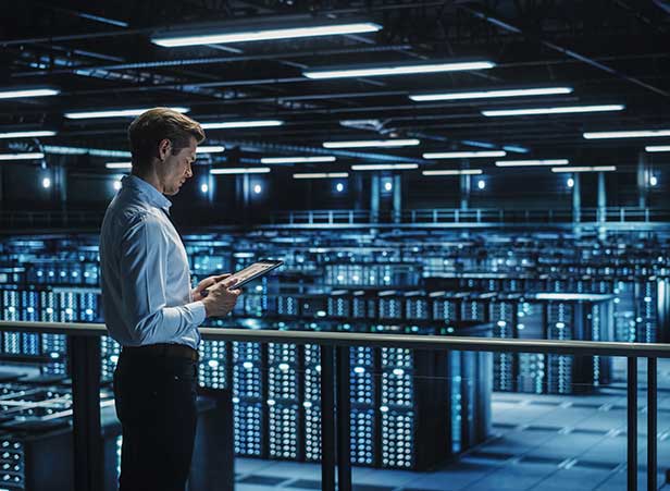 man over looking datacenter